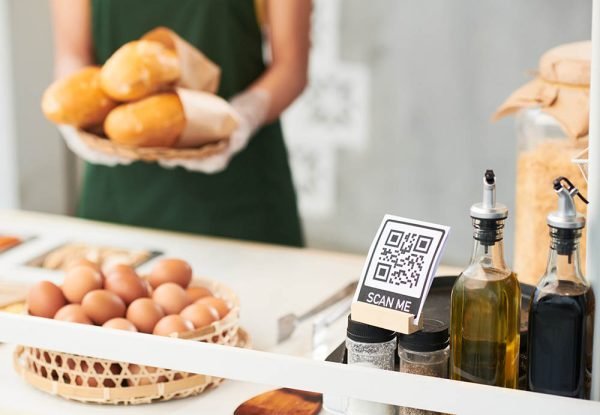 QR code for online payments on street food cart and vendor with