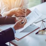 Group of middle age Asian business people and lawyers discussing